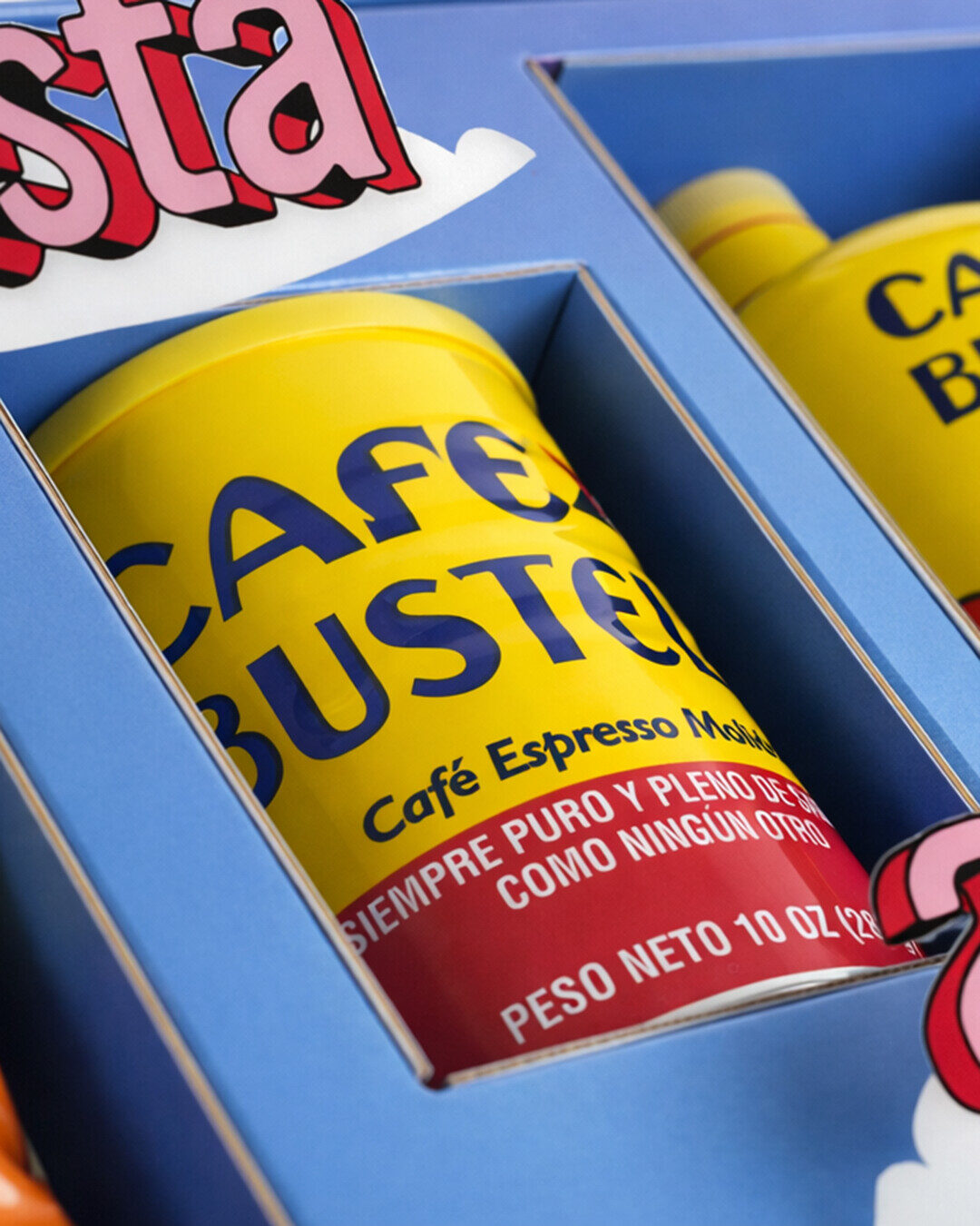Café Bustelo espresso tins framed by dimensional blue packaging