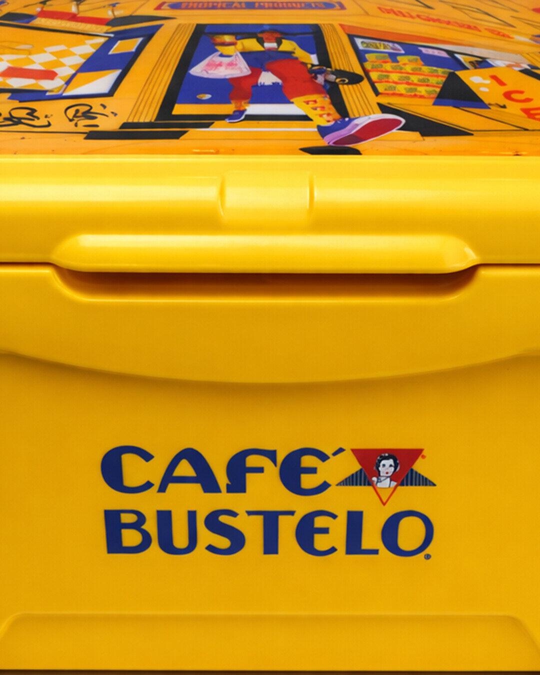 Close view of the yellow Café Bustelo cooler and its illustrated lid