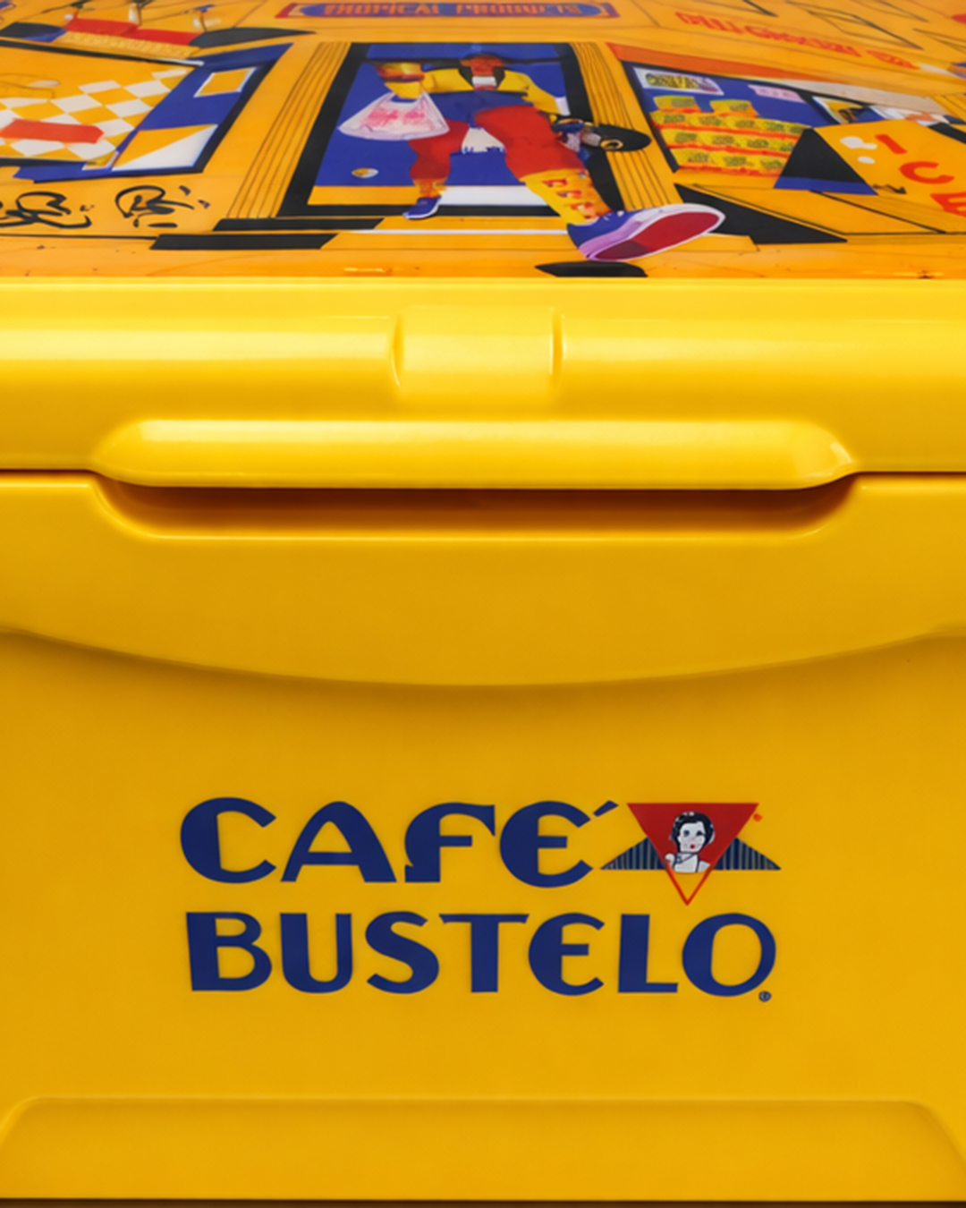 Close view of the yellow Café Bustelo cooler and its illustrated lid