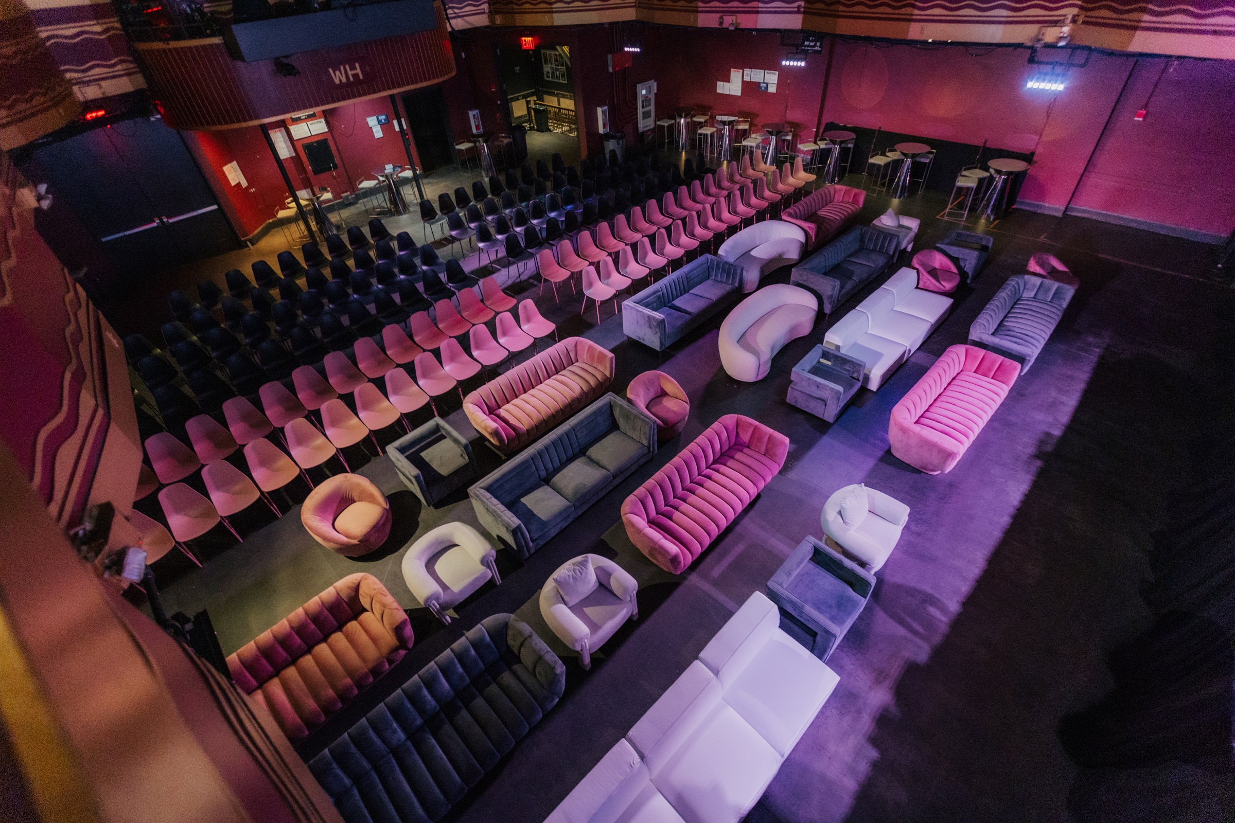 Rose, ivory and grey seating arranged across the Webster Hall floor