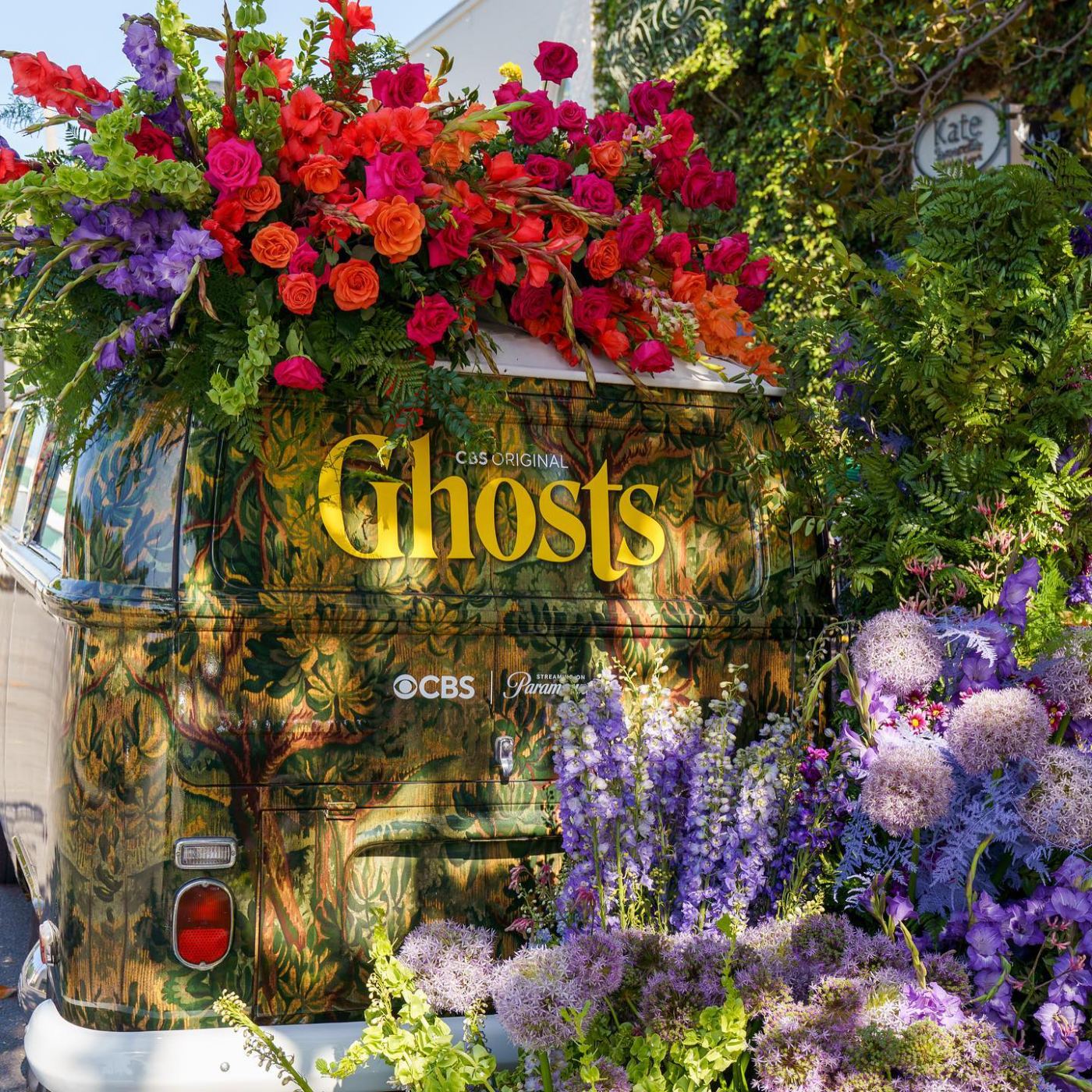 Rear of the Ghosts flower bus surrounded by roses, delphinium and allium