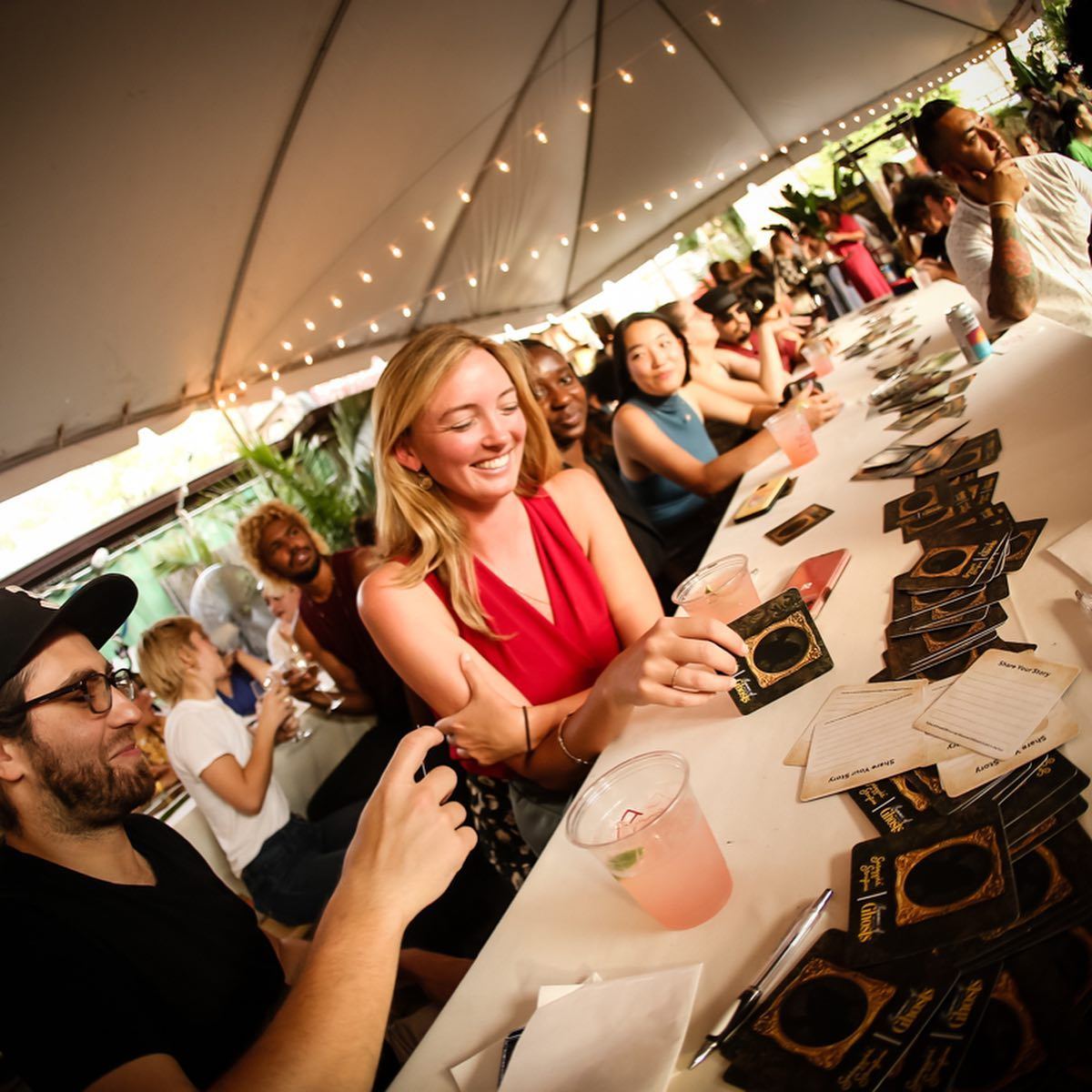 Guests at the storytelling tables with Share Your Story cards