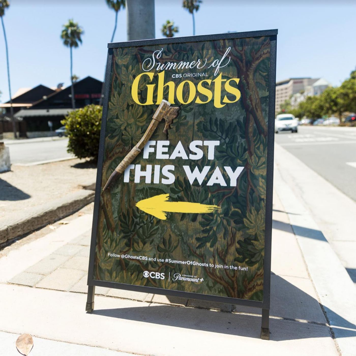 Feast This Way A-frame sign with hatchet pointing guests to the dock