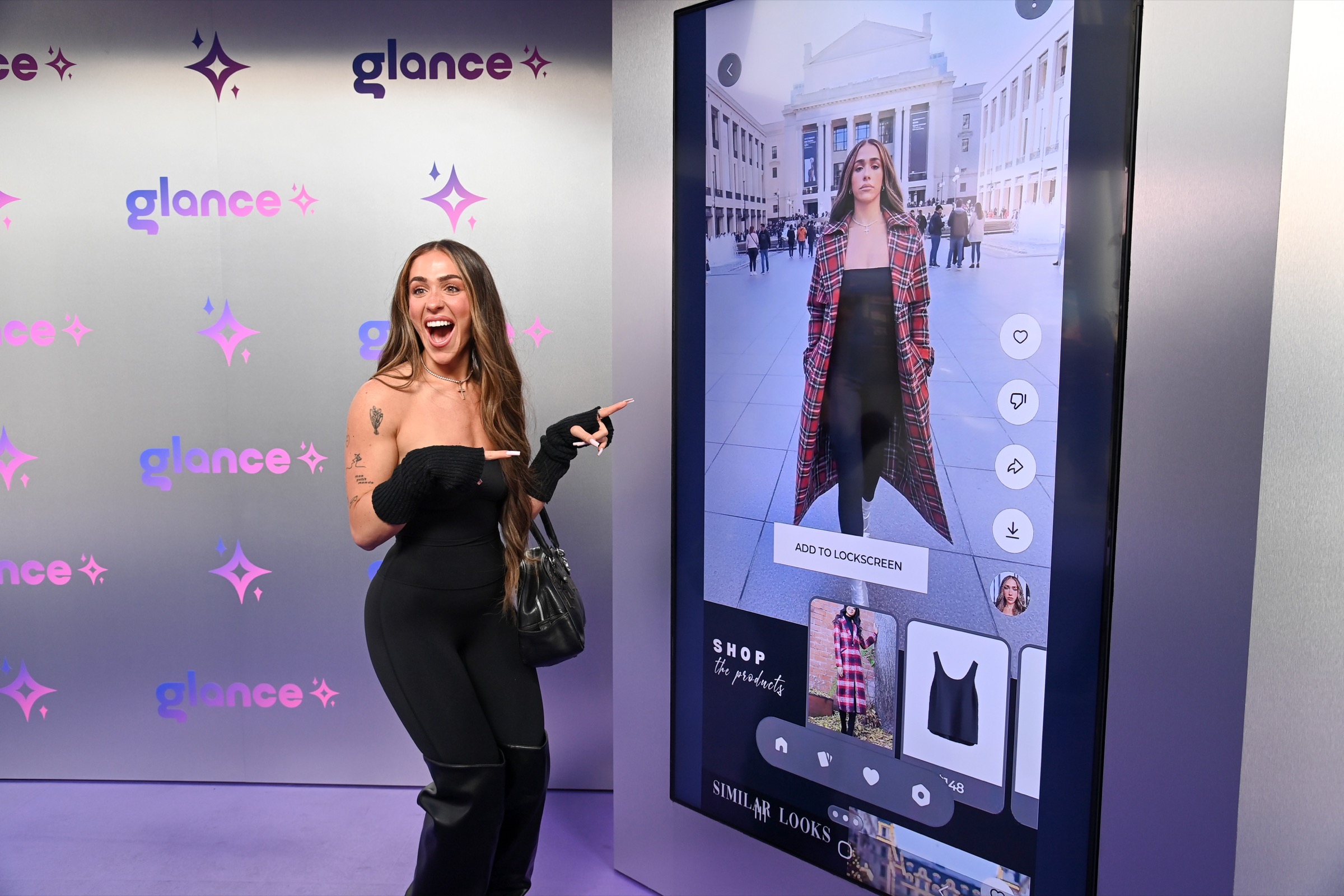 A guest seeing her AI-generated fashion look on the Glance screen