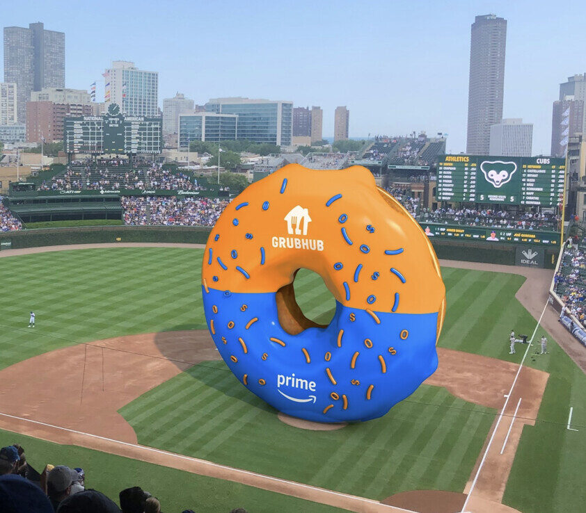 Oversized donut teaser rendered over the Wrigley Field diamond
