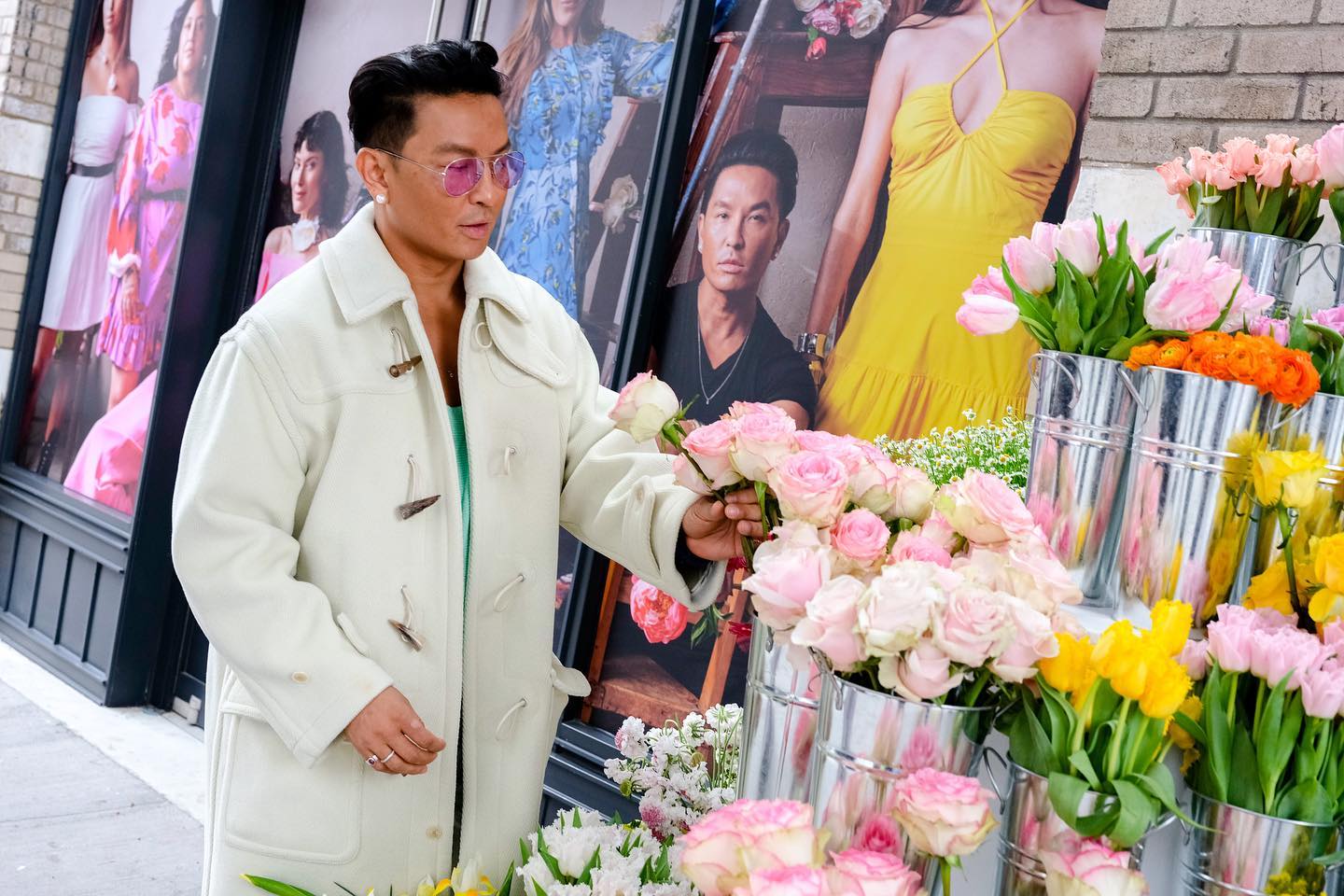 Guest selecting flowers outside the Prabal Gurung pop-up