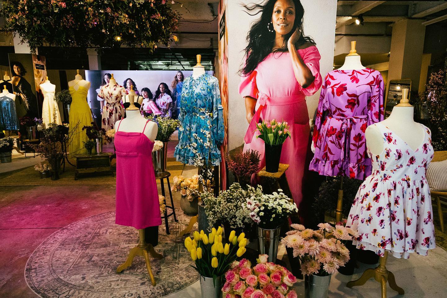 Prabal Gurung spring dresses displayed among fresh flowers