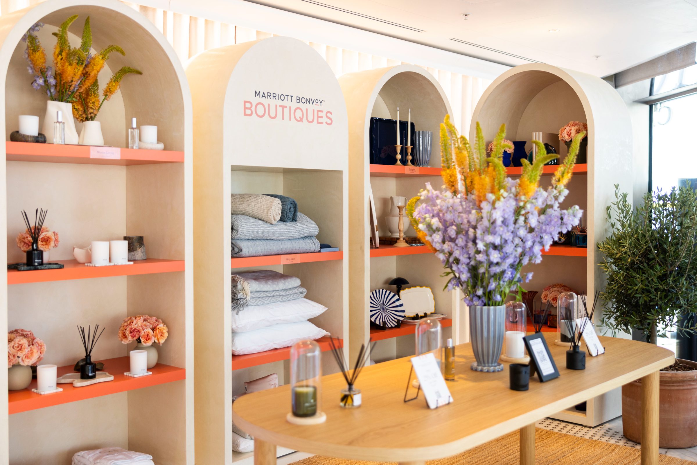 Marriott Bonvoy Boutiques arched displays with the fragrance table in the foreground