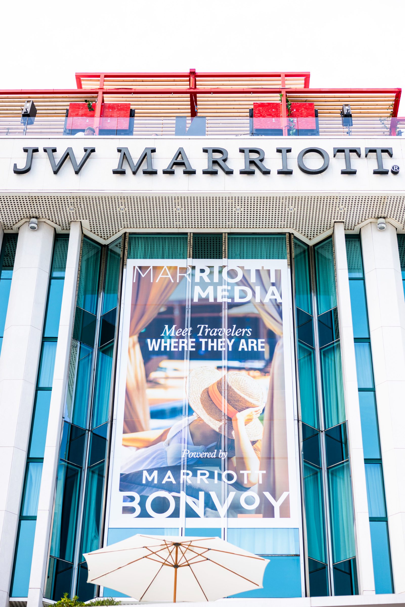 Marriott Media and Marriott Bonvoy banners across the JW Marriott Cannes facade