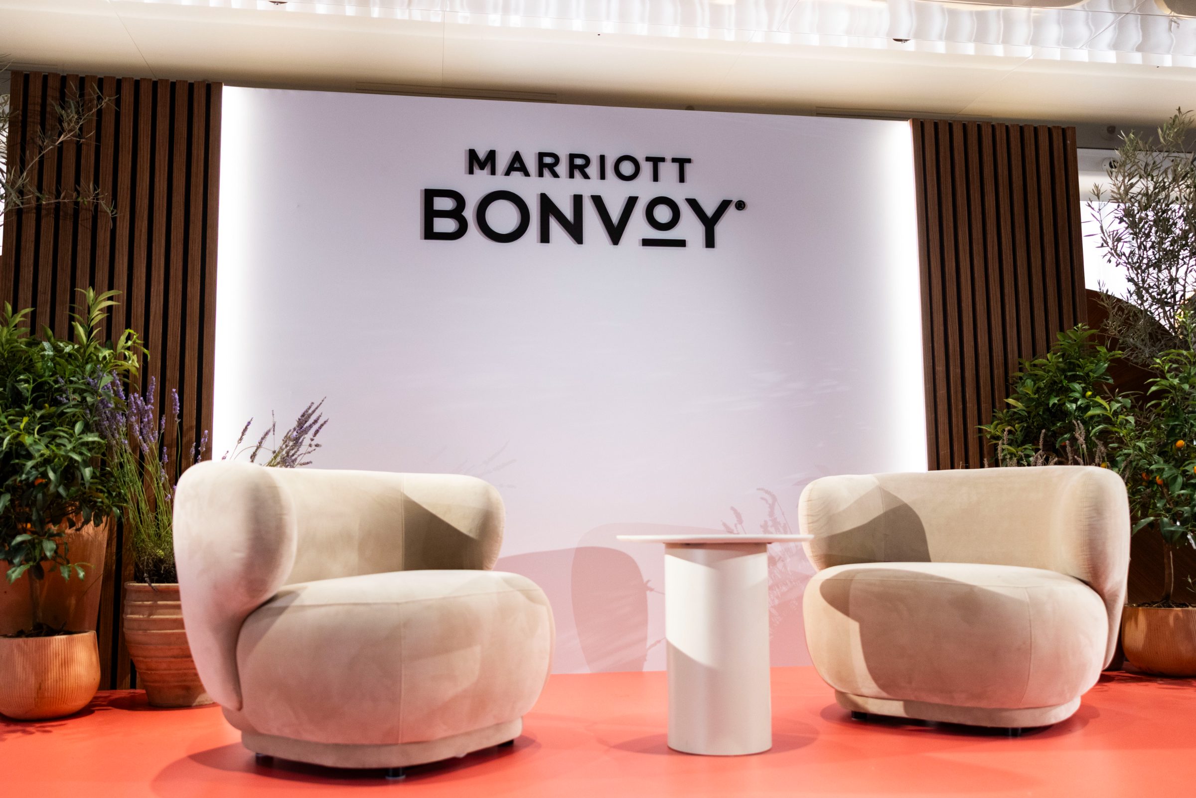 The Lounge stage set with the Marriott Bonvoy backdrop and coral platform