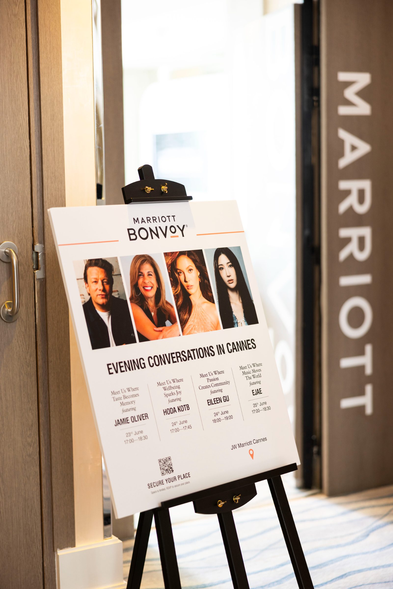 Easel signage listing the Member Day conversation lineup