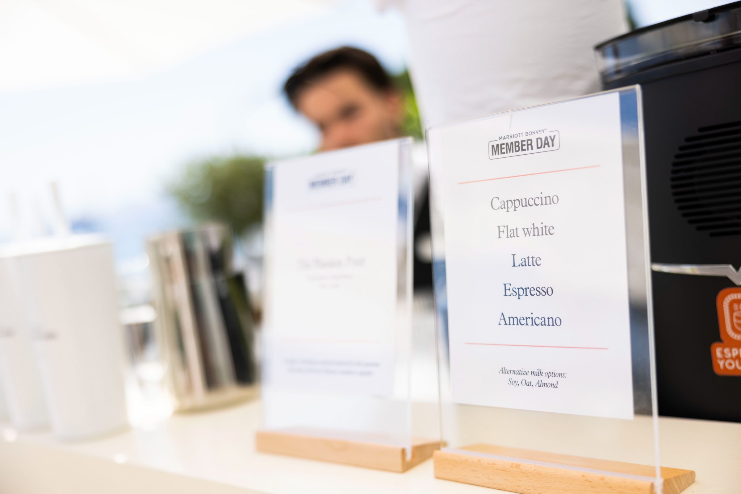 Member Day coffee bar menu cards in acrylic stands