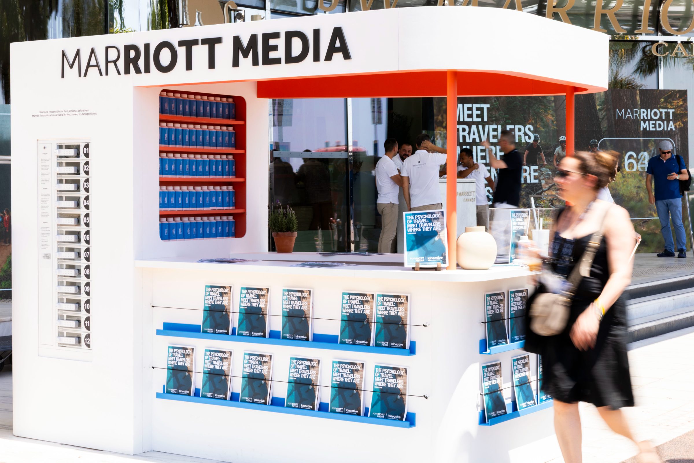 The Marriott Media newsstand on the Croisette with report racks and the water bottle wall
