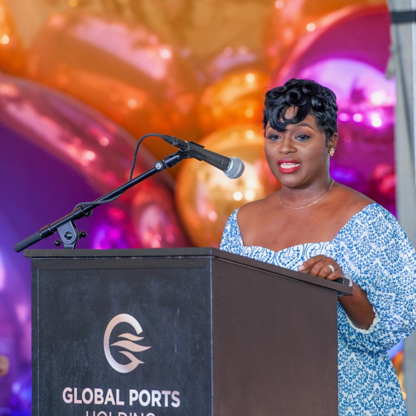 Speaker at a Global Ports Holding podium