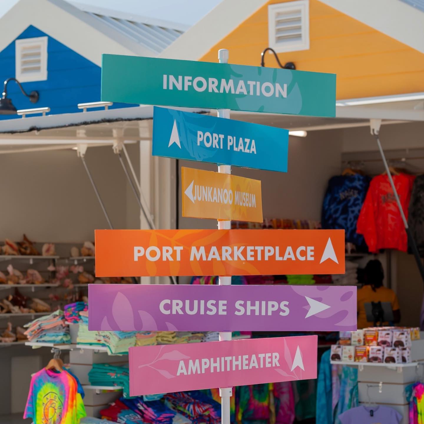 Colorful wayfinding signs directing visitors through Nassau Cruise Port