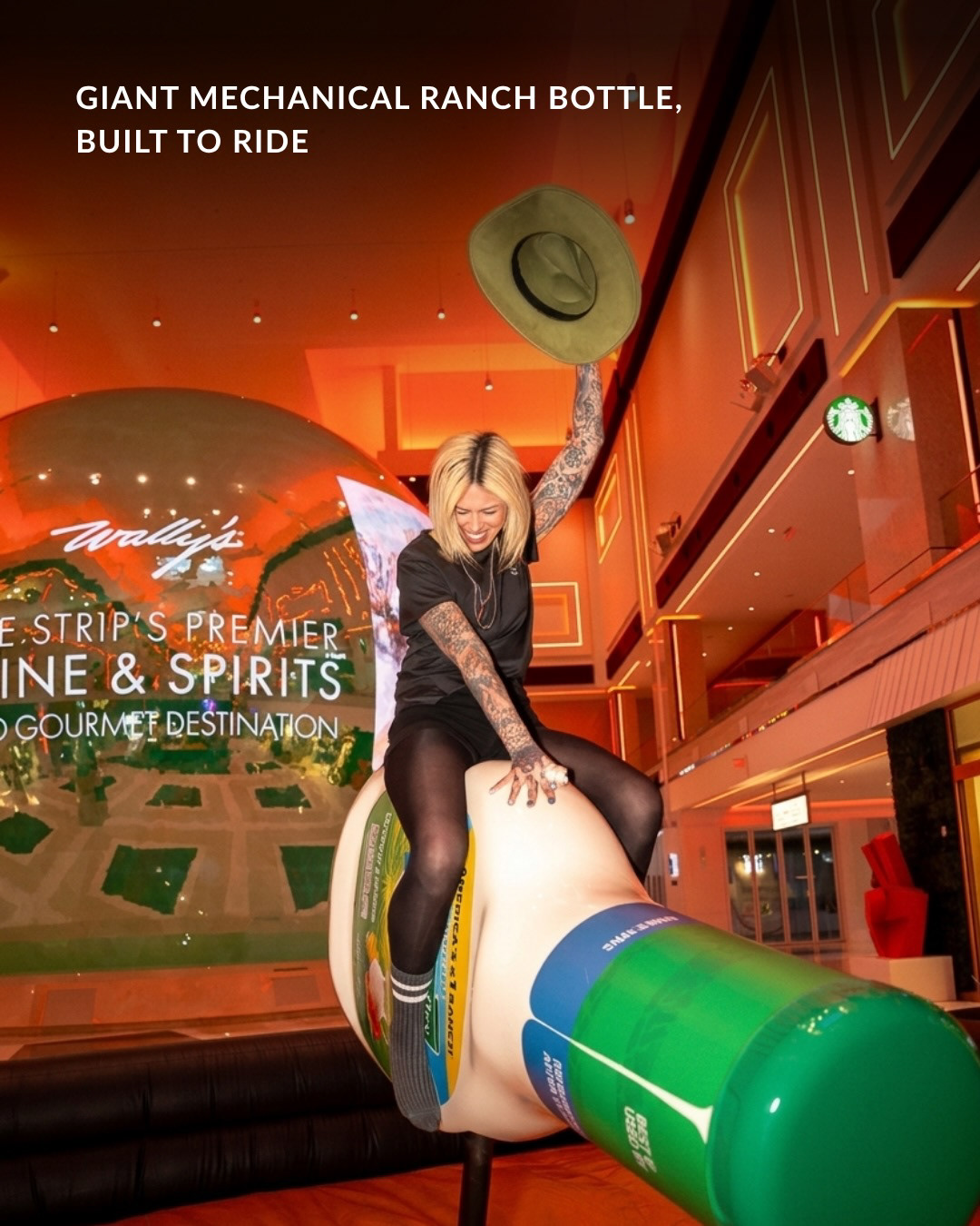 Guest riding the giant mechanical Hidden Valley Ranch bottle
