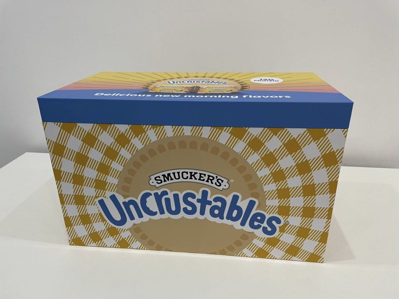 Closed Uncrustables protein seeding presentation box