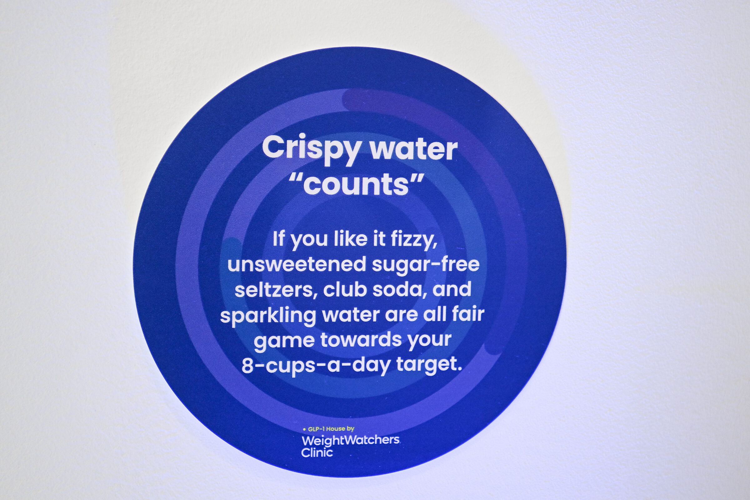 A blurple 'Crispy water counts' hydration-station graphic