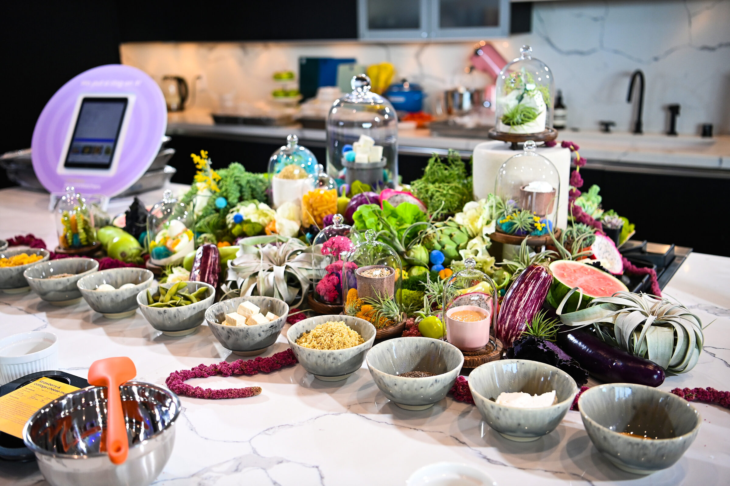 A colorful produce spread styled across the kitchen counter